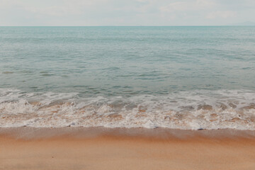 Fototapeta na wymiar sea waves at the sand