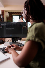 African american student learning programming writing source code while boyfriend is relaxing in...