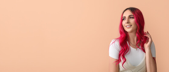 Beautiful woman with bright pink hair on color background with space for text