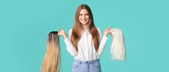 Beautiful young woman with different wigs on turquoise background
