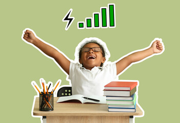 Happy little African-American girl sitting at desk against green background