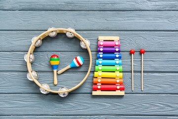 Different musical instruments on wooden background