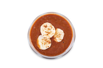 Coffee banana smoothie in a glass on a white isolated background