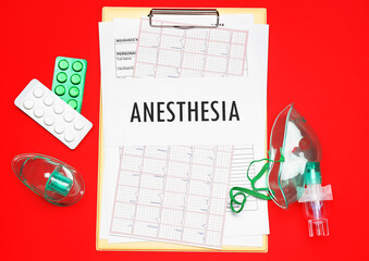 Clipboard with word ANESTHESIA, pills and oxygen masks on red background