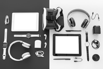Set of different modern gadgets on black and white background