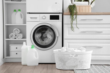 Laundry room with washing machine and white counters