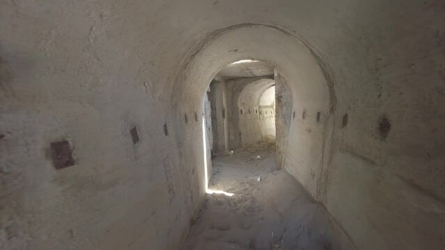 interior of small bunkers of Albania is compact and spartan, featuring a simple design with concrete walls and a narrow entrance. built during the Communist era, were intended as defensive structures.