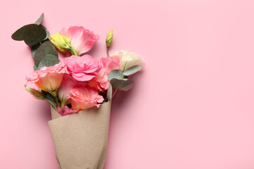 Bouquet of beautiful eustoma flowers on pink background