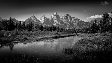 Fototapeta premium Black and White Landscape Photo of the view of the Grand Tetons from Schwabacher Landing in Grand Teton National Park, Wyoming, USA