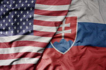 big waving colorful flag of united states of america and national flag of slovakia .