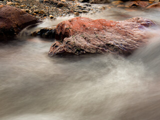 Long-exposure photography of the stream an the rocks of the El Valle river, in the eastern Andean mountains of central Colombia, near the town of Arcabuco.