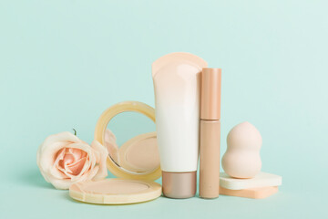 Composition with makeup products for skin tone on color background