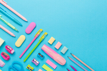 Flat lay with colorful school stationery on color backgroung, top view