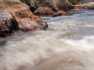 Long-exposure photography of the stream an the rocks of the El Valle river, in the eastern Andean mountains of central Colombia, near the town of Arcabuco.