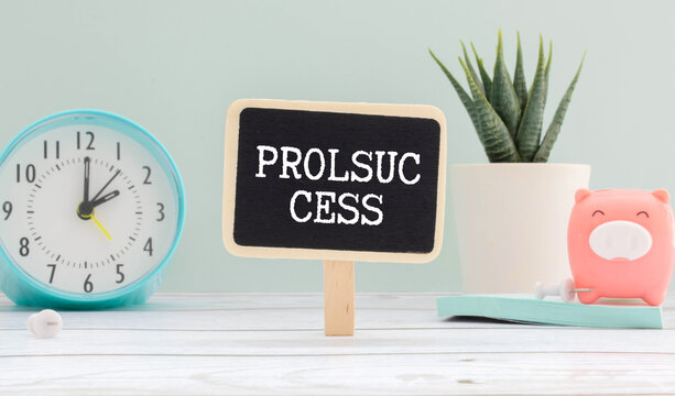 an alarm clock, a piggy bank, and a Prolsuc cess on a black sign.