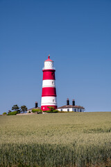 Fototapeta na wymiar View of Happisburgh lighthouse on a spring afternoon, North Norfolk, England
