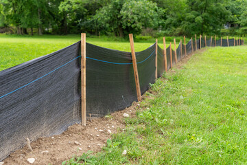 Silt Fence fabric with wooden posts installed prior to the start of construction.
