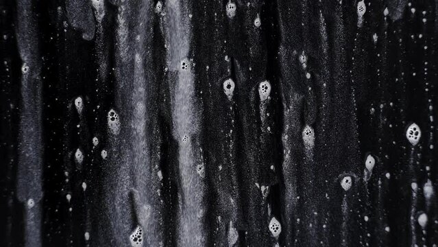 Soap water with bubble foam on a black background