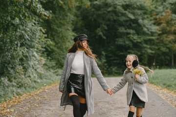 Cute and stylish family in a autumn park