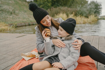 Cute and stylish family in a autumn park