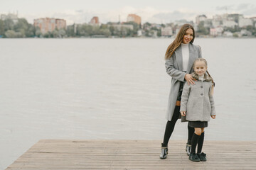 Cute and stylish family in a autumn park
