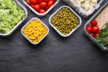 Plastic and glass containers with different fresh products on black table, flat lay. Space for text