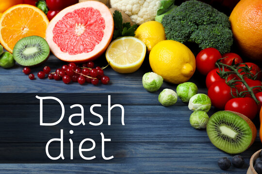 Dietary approaches to stop hypertension. Many different healthy food and words Dash diet on blue wooden table