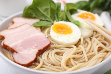 Delicious ramen with meat in bowl, closeup. Noodle soup
