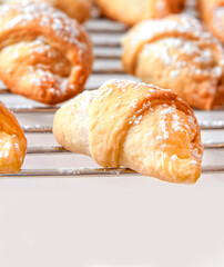 Homemade mini croissants on a on the grid. Confectionery menu co