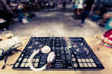 Blurred DJ Mixing Music at Office New Year Party - Energetic Nightlife Celebration with Dynamic Beats