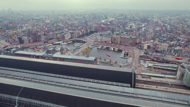 Aerial Panorama Of Amsterdam Centraal Central Railway Station By The River IJ, Netherlands. High Quality 4k Footage