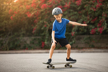 Active boy skateboarding outdoors having fun 