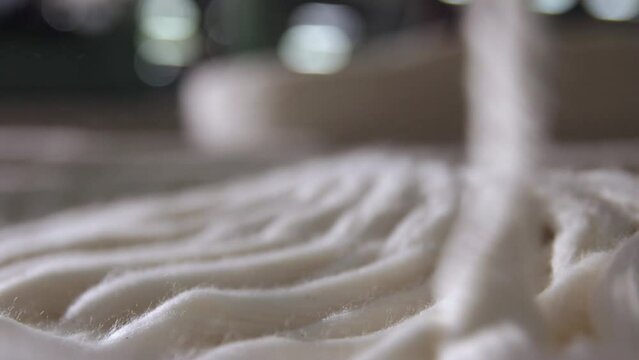 Macro Shot Of Cotton Fibers During Spinning Process To Manufacture Thread