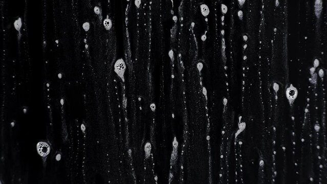 Soap water on a wet surfeac with a black background