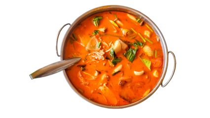 Creamy Tom Yum soup in a pot from top view. Isolated white background.