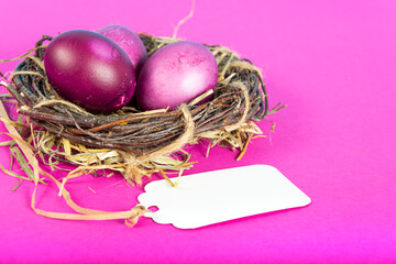 Colorful background with Easter eggs on pink background. Happy Easter concept. Can be used as poster, background, holiday card. Flat lay, top view, copy space. Studio Photo