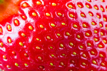 Extreme macro of red strawberry texture for background