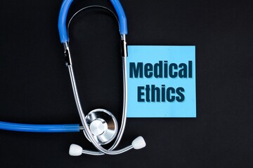 stethoscope and colored paper with the word Medical Ethics. concept of medical ethics