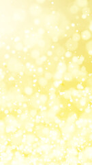 キラキラと光る金色の光。玉ボケ。（縦長）