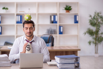 Young male employee in planning retirement concept