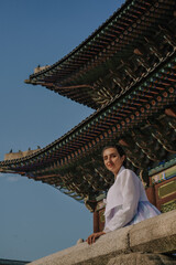 Tourist girl wearing a traditional korean hanbok at the Changgyeonggung Palace, Seoul, South Korea.