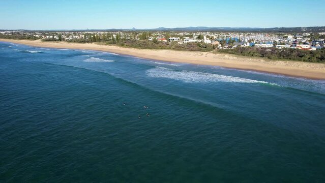 Surfers In The Sea At The Kawana Beach In Queensland, Australia. wide aerial