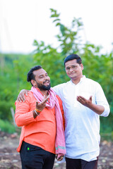 two indian farmer standing in farm