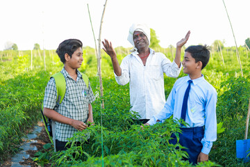 Indian three people standing in farm