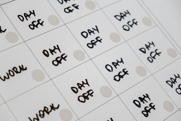 Magnetic board writing 4 day work week calendar with three weekend days off four day working week concept. Modern approach doing business short workweek. Effectiveness of employees. Productivity and