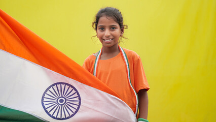 Indian Teenager girl holding flags on occasion of Independence Day India