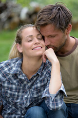 Fototapeta premium young couple hugging in a park
