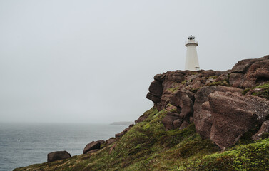 Fototapeta na wymiar Lighthouse at Cape Spear, Newfoundland on cloudy day.