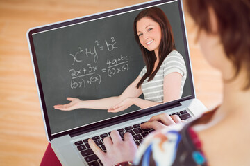 Caucasian woman looking at teacher teaching mathematics on laptop screen during online class