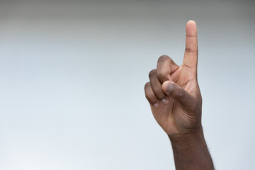 Hand of black African Man Pointing Up one finger Gesture for Success, Goal, Direction concept on Isolated Background